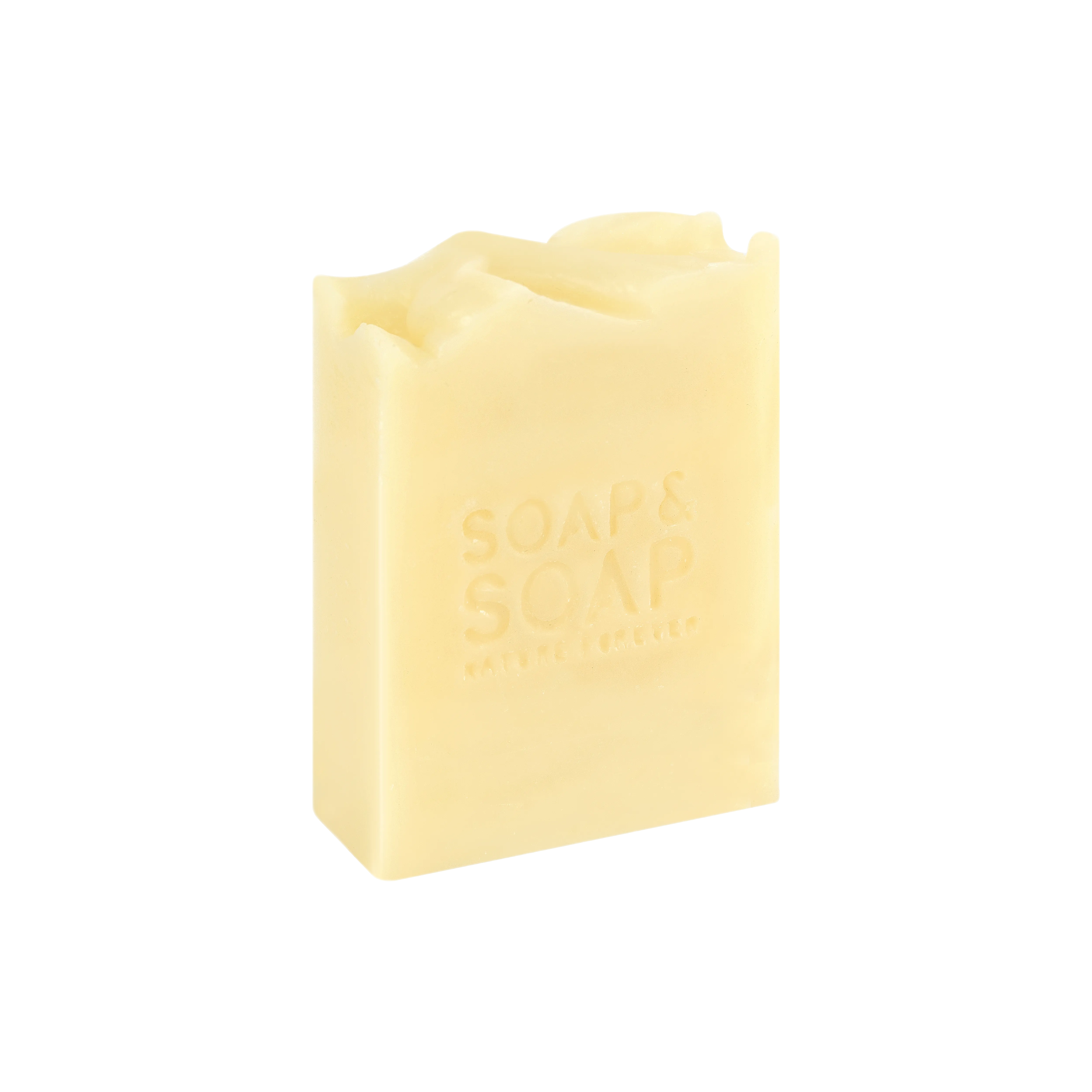 A bar of handmade Turkish bath soap with a yellowish hue, bearing the text 'SOAPS & SPA' embossed on its surface.